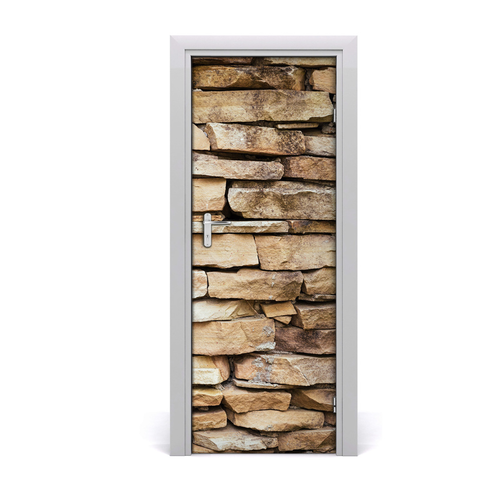 Autocolant de uși Un zid din cărămizi de piatră