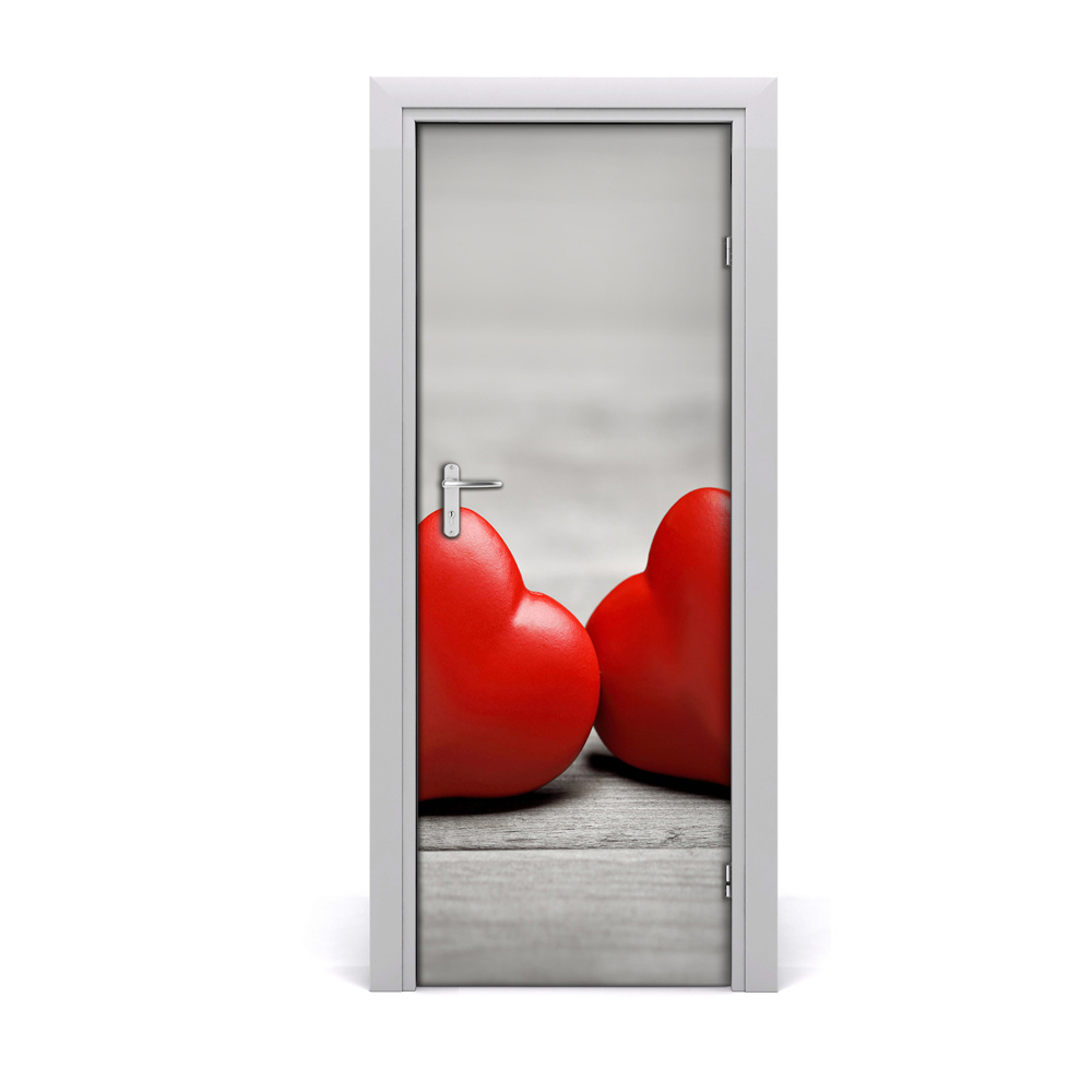 Autocolant de uşă Inimi roșii pe un fundal de lemn