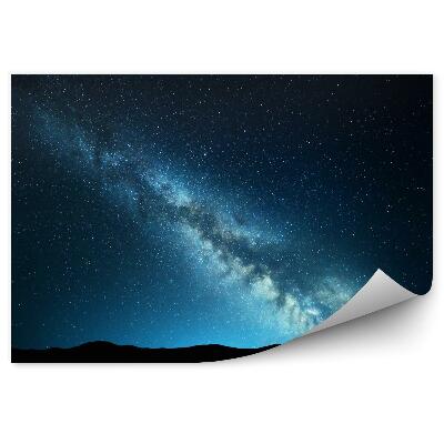 Fototapeta Nocny krajobraz z niesamowitą drogą mleczną niebieski noc gwiaździste niebo ze wzgórzami