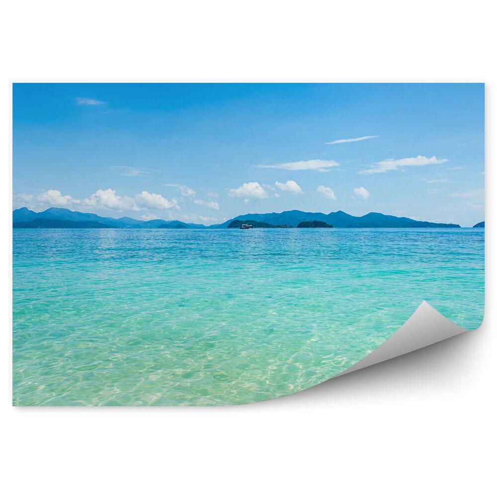 Fototapet Nisip Ocean Munți Cer Nori