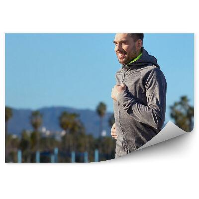 Fototapet vintage Alergare palmieri munți munți plaja cer