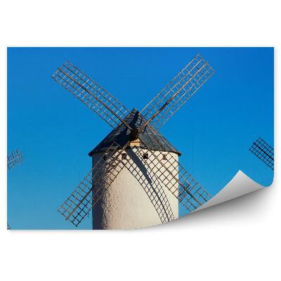 Fototapet perete Trei mori de vânt mari și albe pe un cer albastru