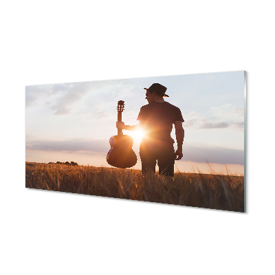 Tablou de sticlă Bărbat Pe Pajiște Cu O Chitară