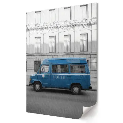 Tablou canvas cu mașină de poliție albastră în peisaj urban